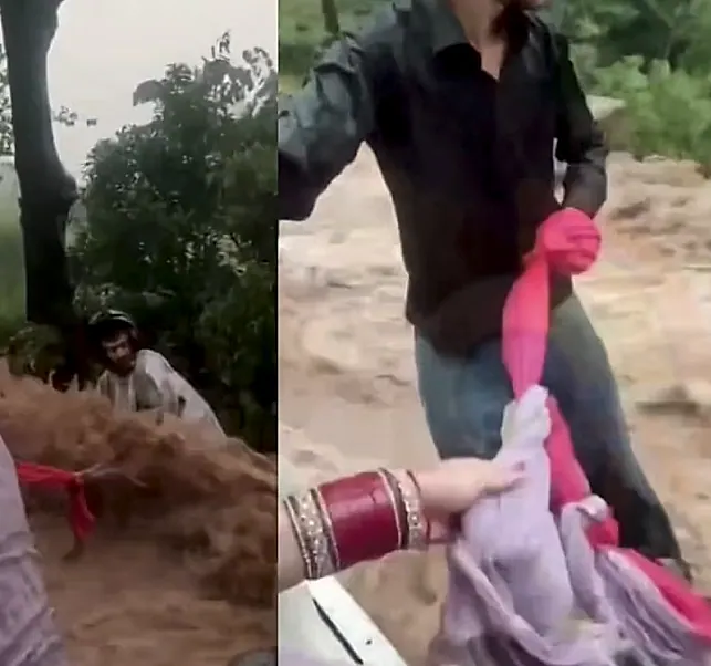 వరదలో కొట్టుకుపోతున్న బైకర్కు ప్రాణదాతలైన నవదంపతులు